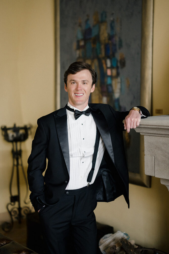 Stuart getting ready for his wedding at Villa Ardore in Chianti, Tuscany, adjusting his suit inside the Italian villa before the outdoor ceremony.