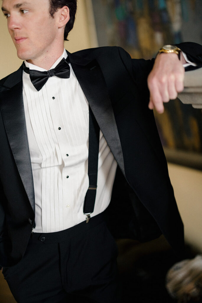 Stuart getting ready for his wedding at Villa Ardore in Chianti, Tuscany, adjusting his suit inside the Italian villa before the outdoor ceremony.