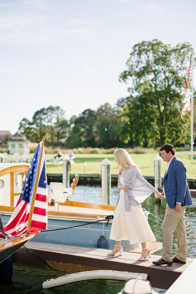 Chesapeake Bay engagement session with Catherine and Taylor sailing during their Maryland waterfront engagement photos
