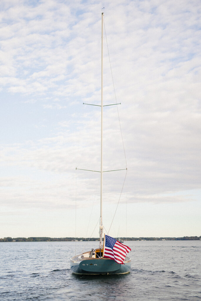 Chesapeake Bay engagement session with Catherine and Taylor sailing during their Maryland waterfront engagement photos