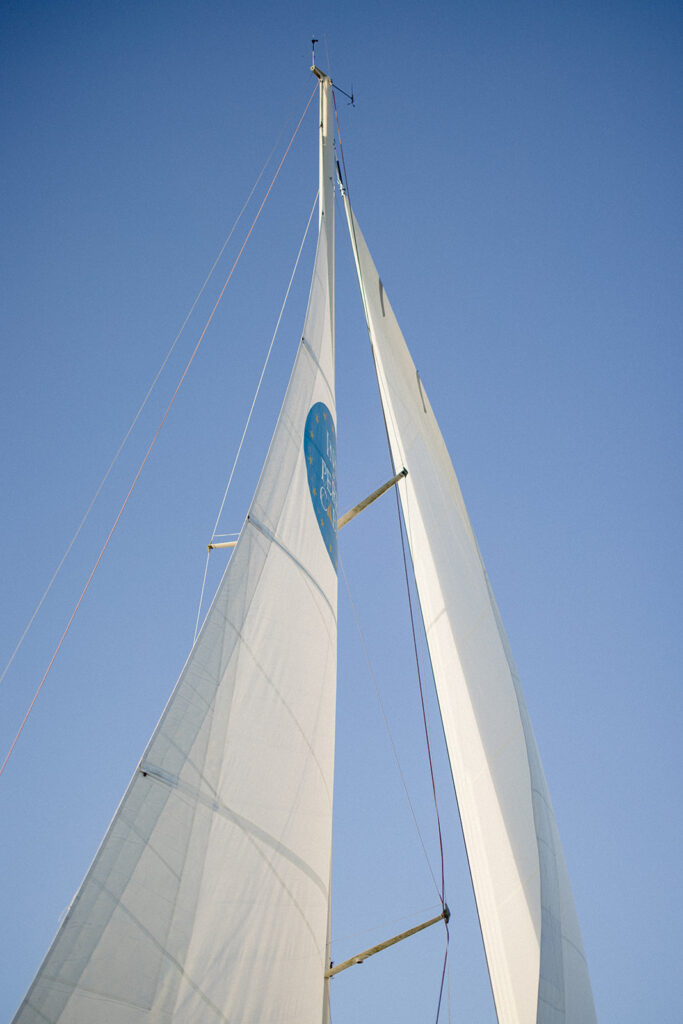 Chesapeake Bay engagement session with Catherine and Taylor sailing during their Maryland waterfront engagement photos