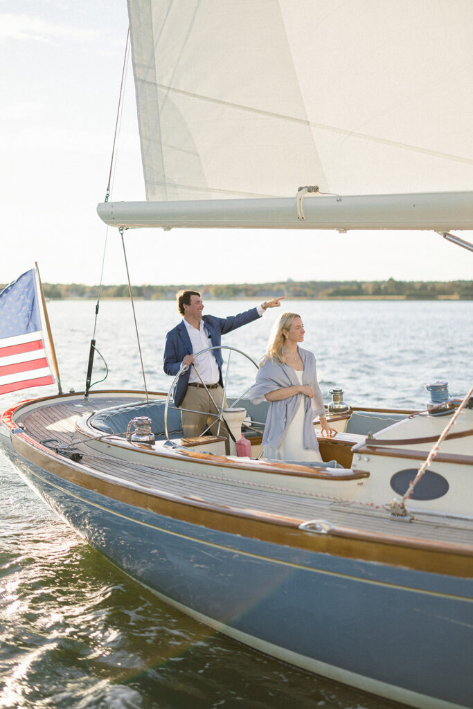 Chesapeake Bay engagement session with Catherine and Taylor sailing during their Maryland waterfront engagement photos