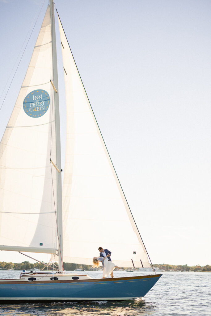 Chesapeake Bay engagement session with Catherine and Taylor sailing during their Maryland waterfront engagement photos