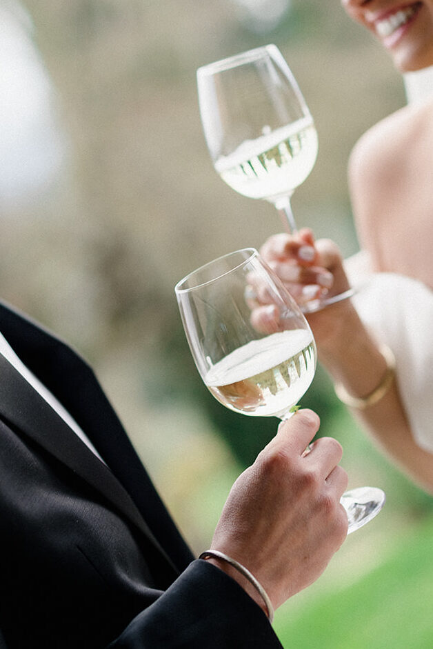 Campbell and Stuart just married at Villa Ardore in Chianti, Tuscany, walking together through the vineyards after their intimate outdoor wedding ceremony in Italy.