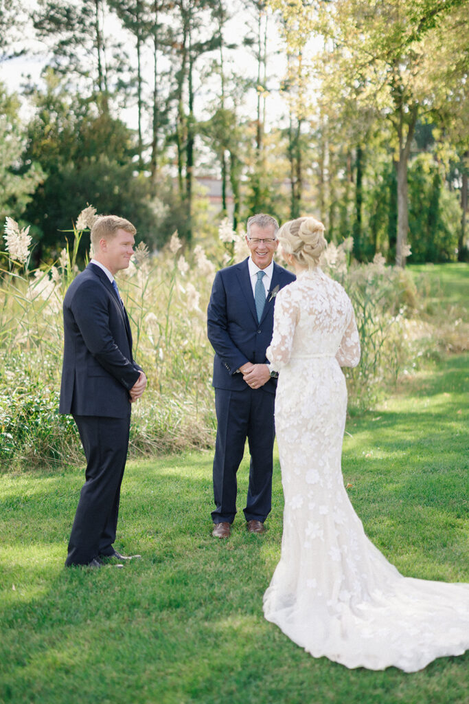 Catherine and Taylor’s fall wedding ceremony at the Inn at Perry Cabin in St. Michaels Maryland overlooking the Chesapeake Bay