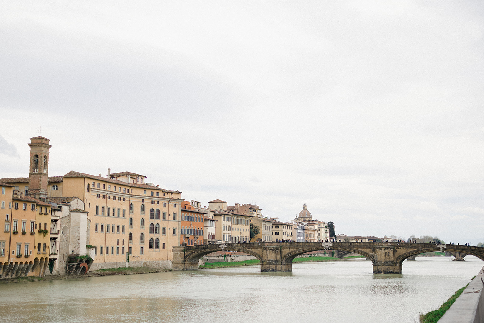 Campbell and Stuart walking together during their engagement session in Florence, Italy, framed by historic architecture and quiet city streets.