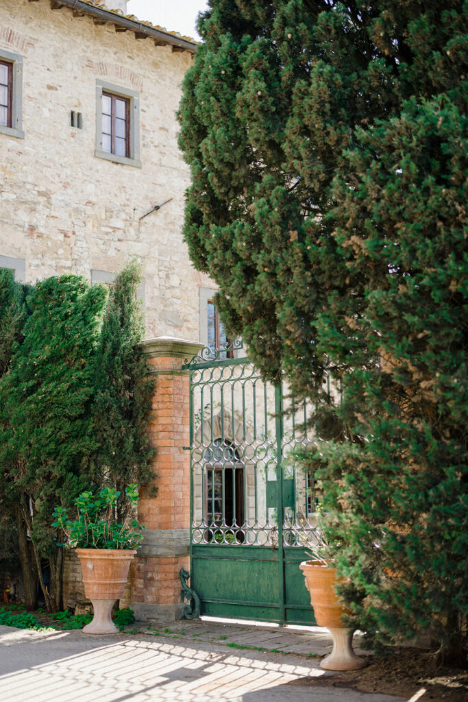Campbell and Stuart participating in a hands-on cooking class in Italy, surrounded by family and shared laughter.