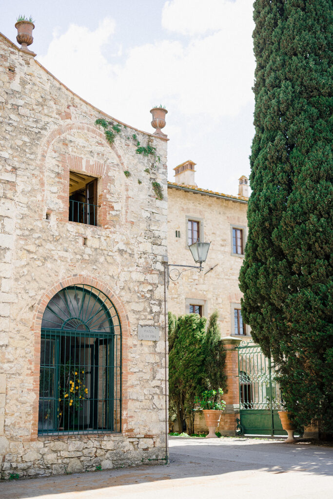 Campbell and Stuart participating in a hands-on cooking class in Italy, surrounded by family and shared laughter.