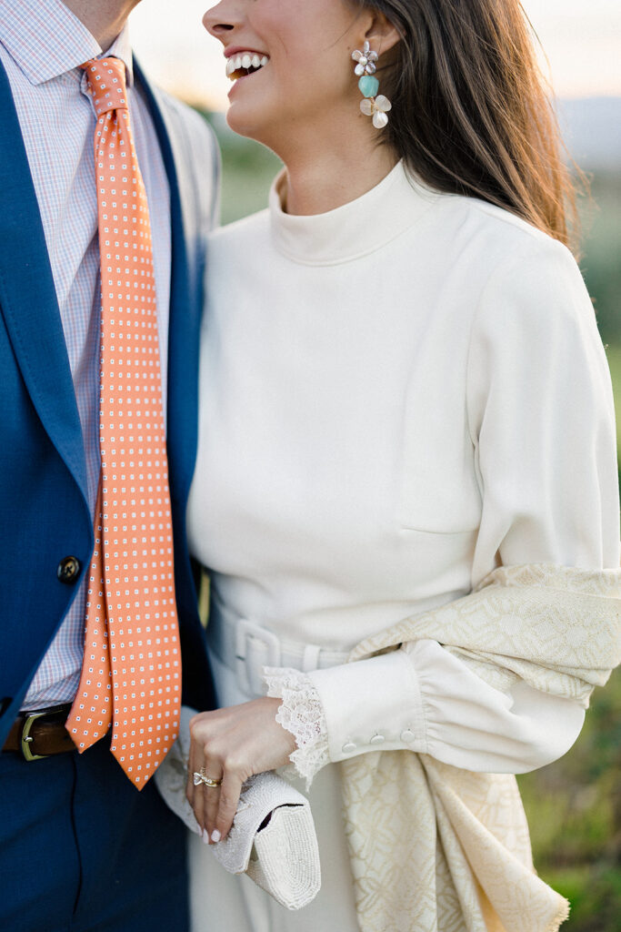 Intimate rehearsal dinner in Italy with candlelit tables, close family, and an outdoor evening setting.
