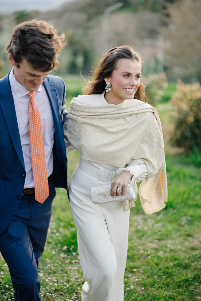 Intimate rehearsal dinner in Italy with candlelit tables, close family, and an outdoor evening setting.