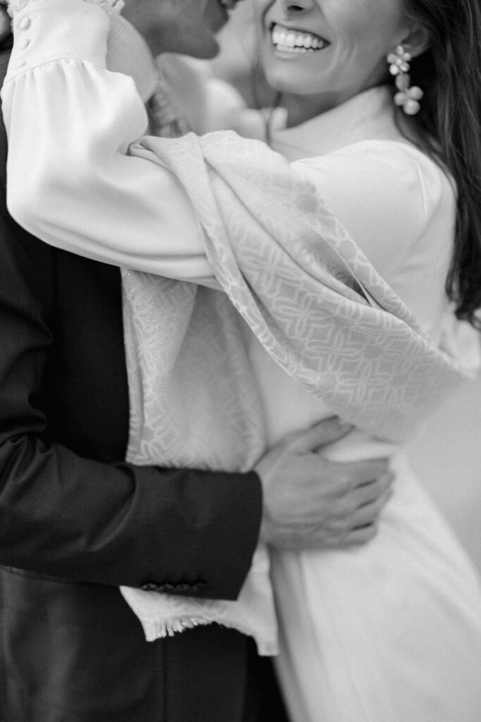 Intimate rehearsal dinner in Italy with candlelit tables, close family, and an outdoor evening setting.