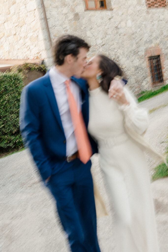 Intimate rehearsal dinner in Italy with candlelit tables, close family, and an outdoor evening setting.