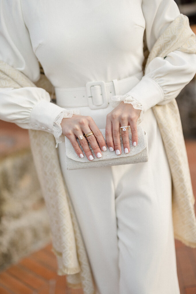 Intimate rehearsal dinner in Italy with candlelit tables, close family, and an outdoor evening setting.