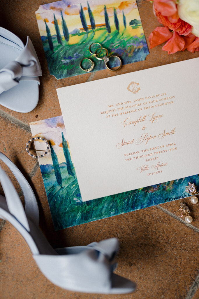Campbell walking down the aisle during her wedding ceremony at Villa Ardore in Chianti, Tuscany, surrounded by vineyards and close family members in an intimate outdoor Italian wedding setting.