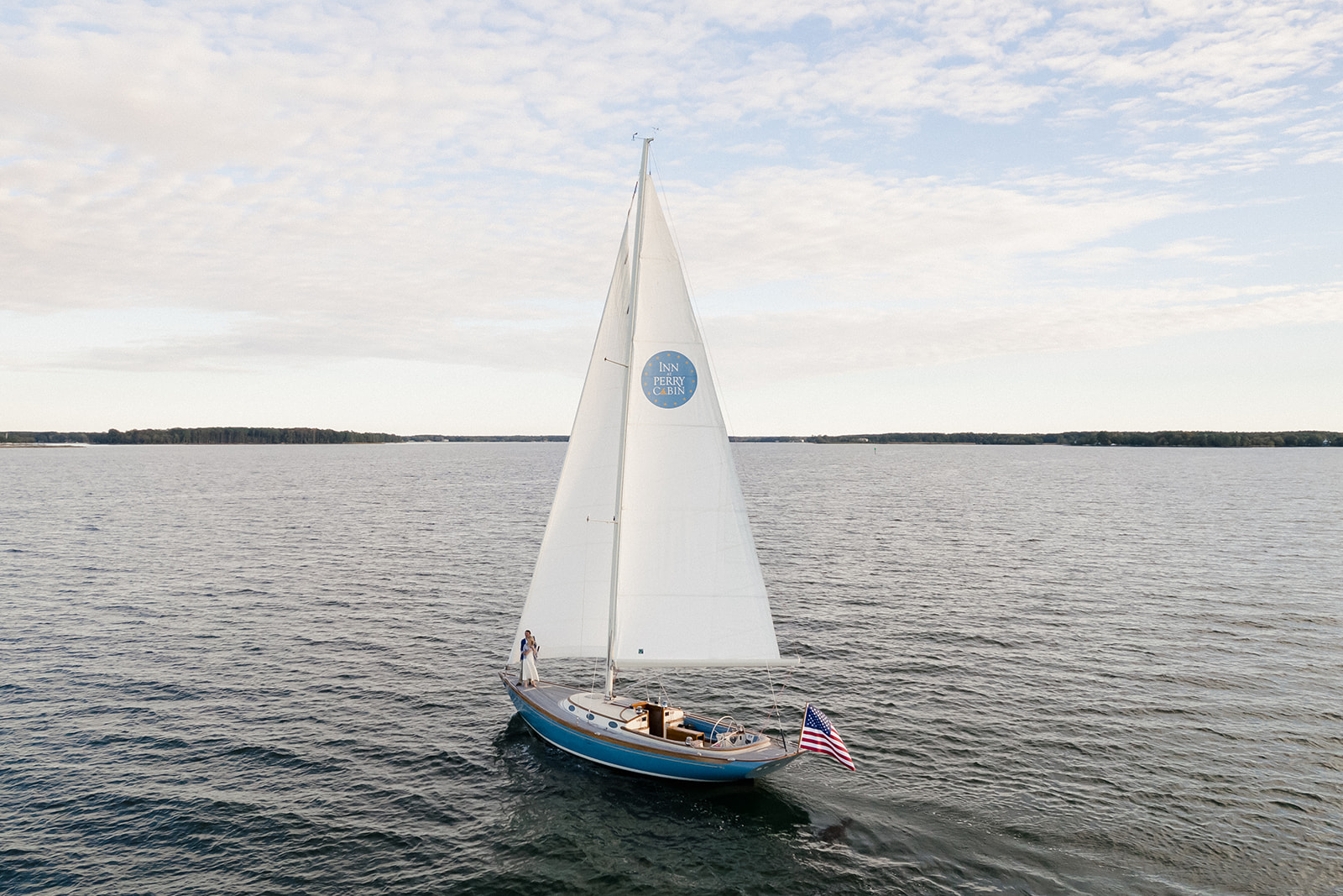 Chesapeake Bay engagement session with Catherine and Taylor sailing during their Maryland waterfront engagement photos